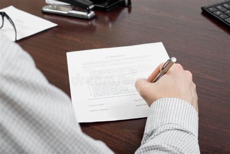 105 Businessman Filling Out Paperwork Desk Stock Photos Free