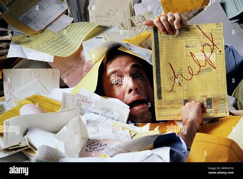 A Businessman Buried In A Mountain Of Paperwork And Asking For Help