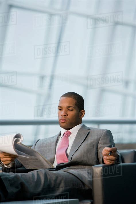 African Businessman Reviewing Paperwork Stock Photo Dissolve