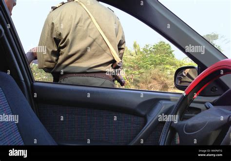 African Checkpoint With Armed Police Officer Looking At Driver S