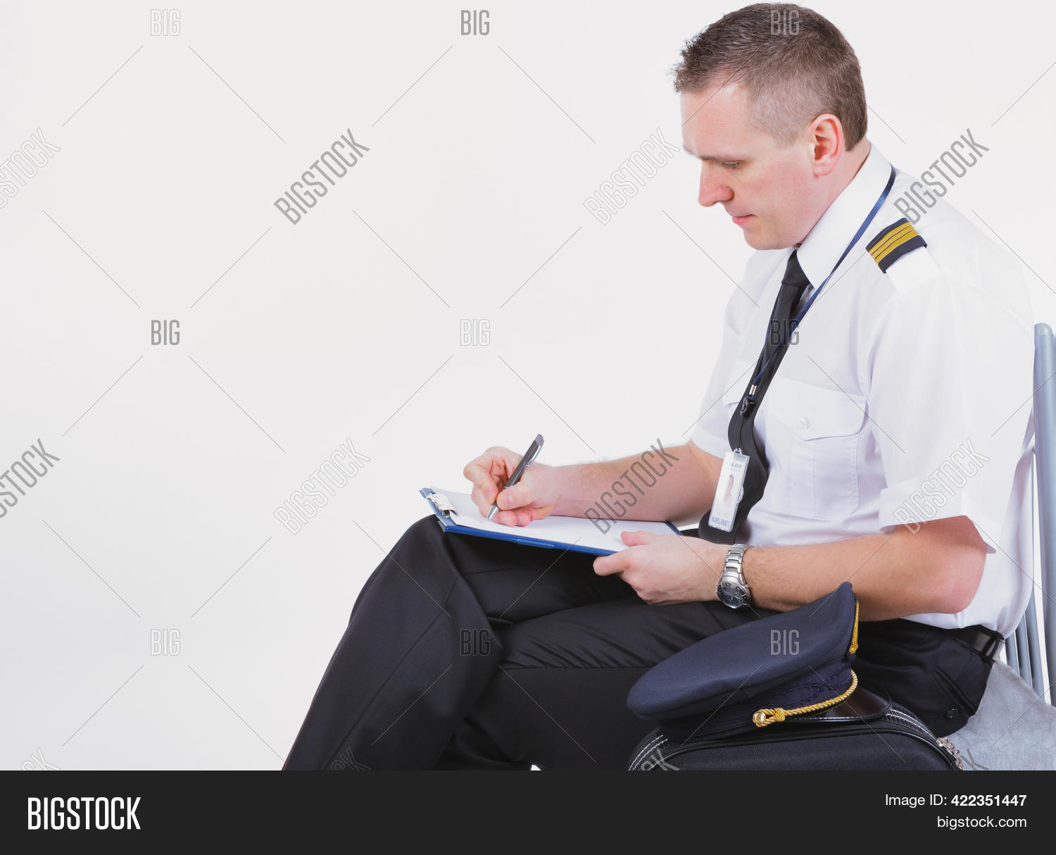 Airline Captain Pilot Fills Out The Paperwork Before The Flight Stock