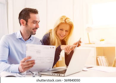 Attractive Couple Doing Administrative Paperwork Stock Photo Image Of Calculator Blond 46551494