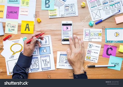 Business Digital Marketing With Paperwork Sketch On Wood Table Stock