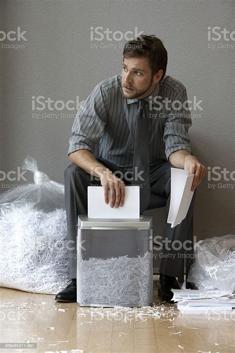 Businessman Shredding Documents Stock Photo Download Image Now