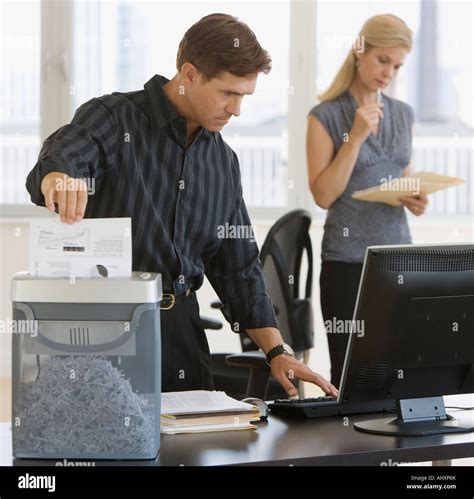 Businessman Shredding Paperwork Stock Photo Alamy