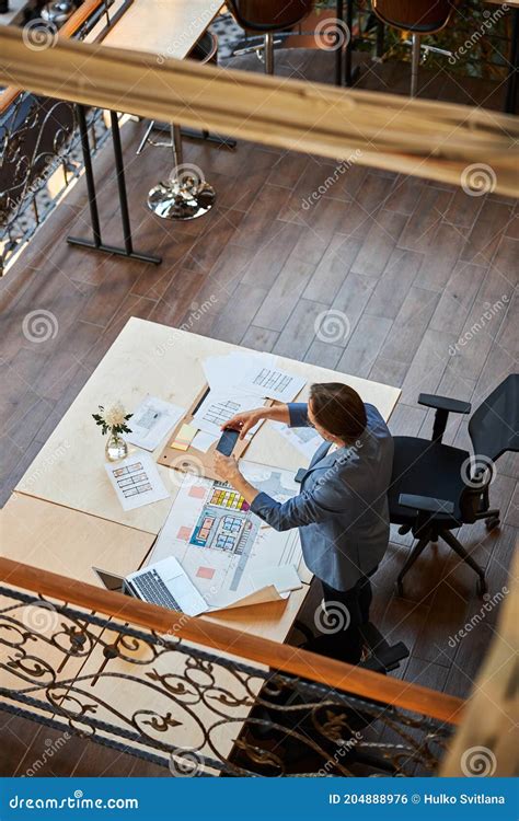 Busy Worker Photographing Paper Documentation On His Phone Stock Photo Image Of Portable