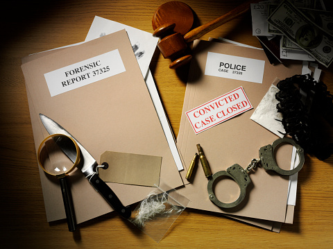 Case Closed With Police Files And Forensic Paperwork Stock Photo