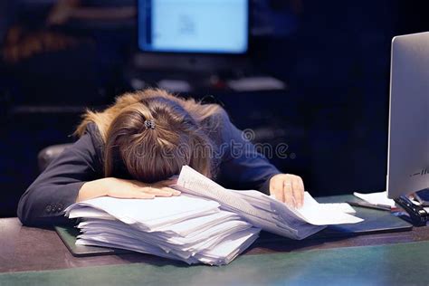 Close Up Of Office Worker Is Distressed With A Lot Of Paperwork In