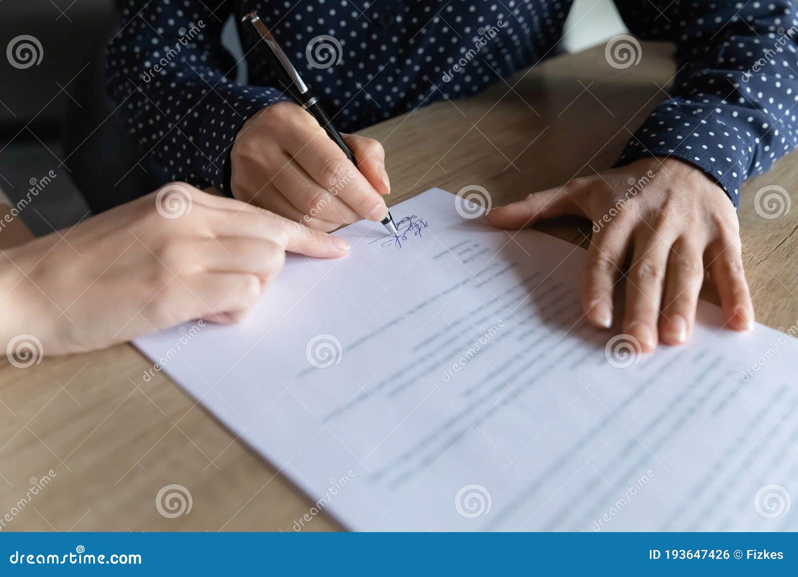 Close Up Young Indian Woman Putting Signature On Hiring Contract Stock