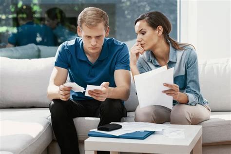 Couple Doing Paperwork Together Planning Family Budget Calculating