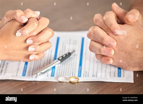 Divorce Signing And Hands Of A Couple With A Document For Court Deal And Legal Paperwork