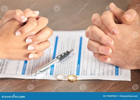 Divorce Signing And Hands Of A Couple With A Document For Court Deal