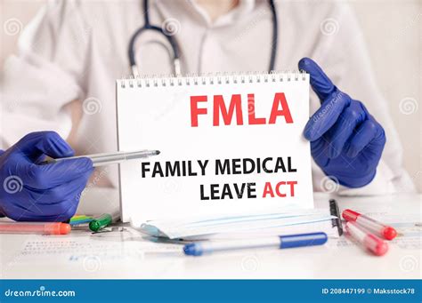 Doctor Holding A Tablet With Text Fmla Family Medical Leave Act