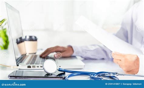 Doctor Woman Typing Information Of Patient Prescription From Paperwork Medical History Form Into