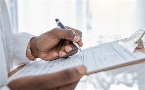 Doctor Writing Medical Form Paperwork And Document For Script Prescription And Sick Note For