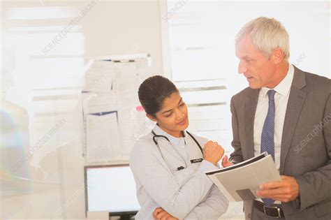 Doctors Reviewing Paperwork In The Office Stock Video Video Of