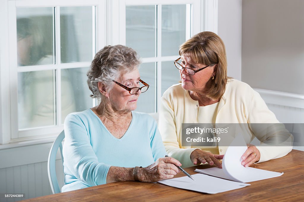 Elderly Woman Reading Paperwork High Res Stock Photo Getty Images