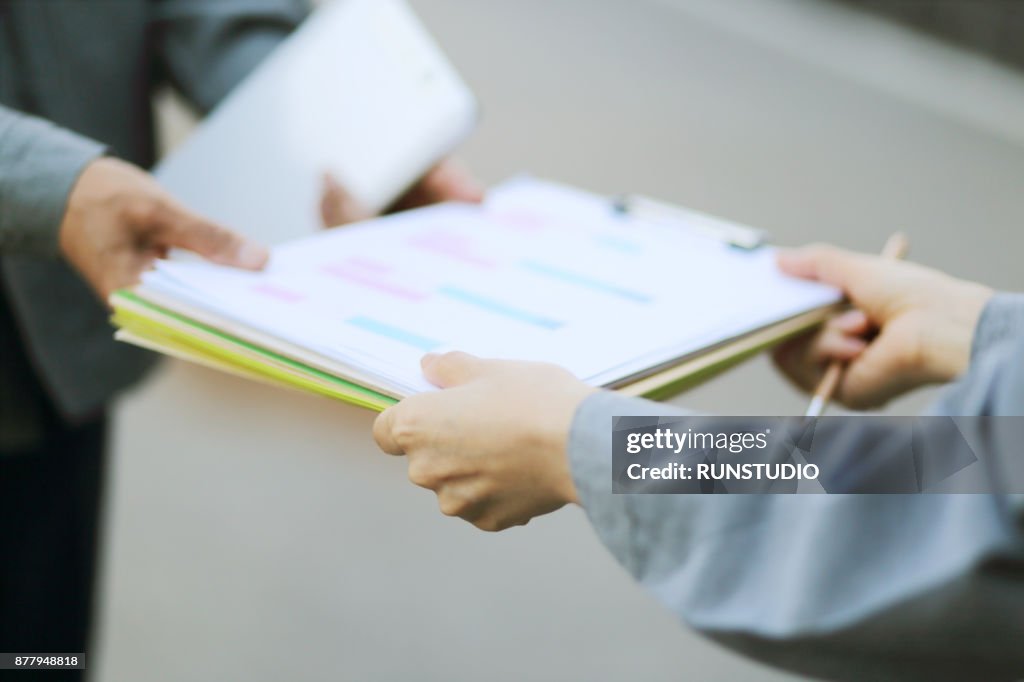 Engineer Receiving Paperwork From Manager High Res Stock Photo Getty