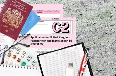 English Form C2 Application For United Kingdom Passport For Applicants Under 16 Lies On Table