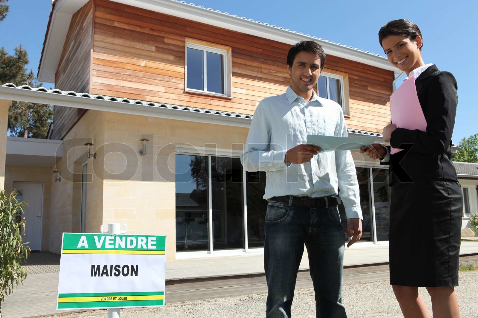 Estate Agent Handing Over Some Paperwork Stock Image Colourbox