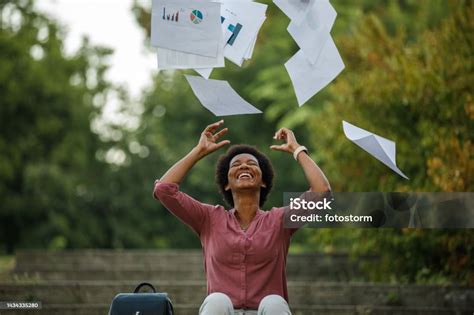 Excited Businesswoman Throwing Project Paperwork After Finishing