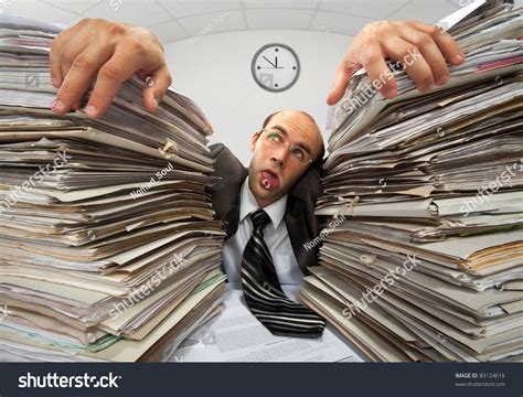 Exhausted Businessman Has Had Too Much Of His Paperwork Stock Photo