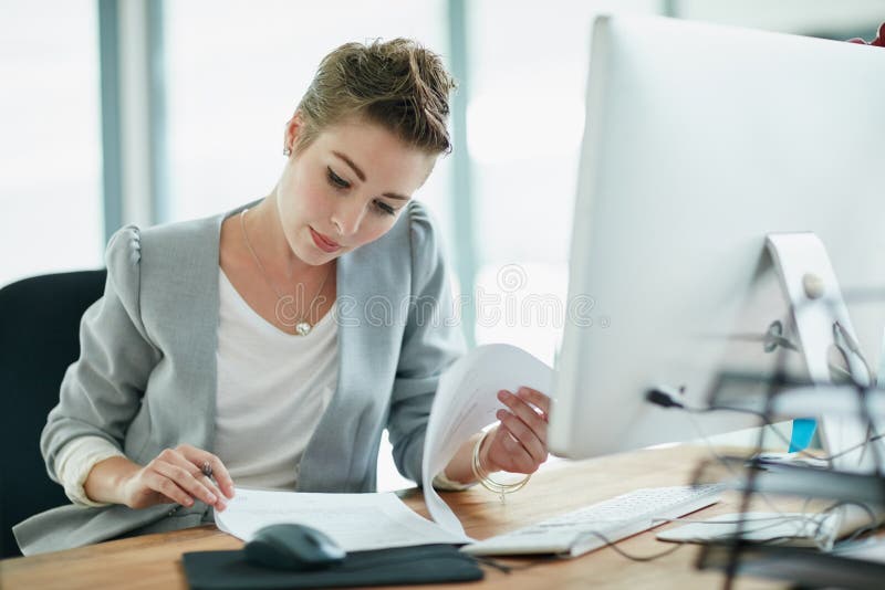 Fact Checking All The Details A Young Businesswoman Reading Some