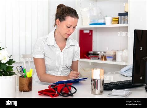 Female Doctor Nurse Or Secretary Is Doing Some Paperwork Stock Image