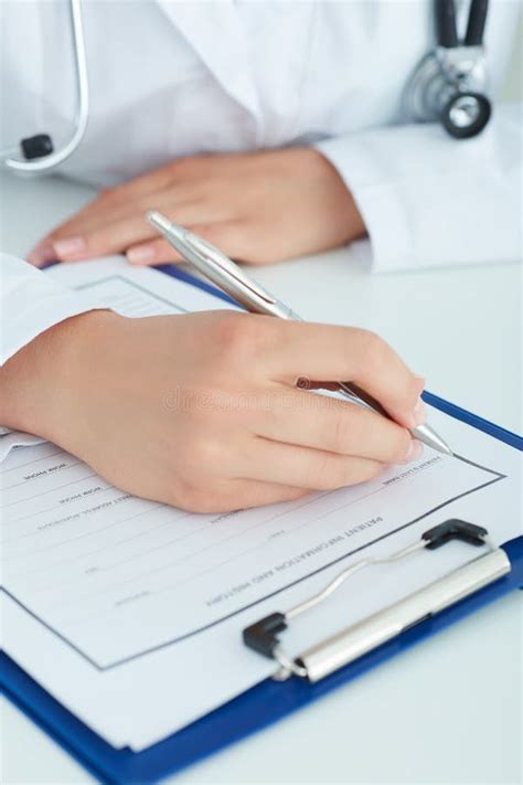 Female Medicine Doctors Hands Filling Patient Medical Form Physician