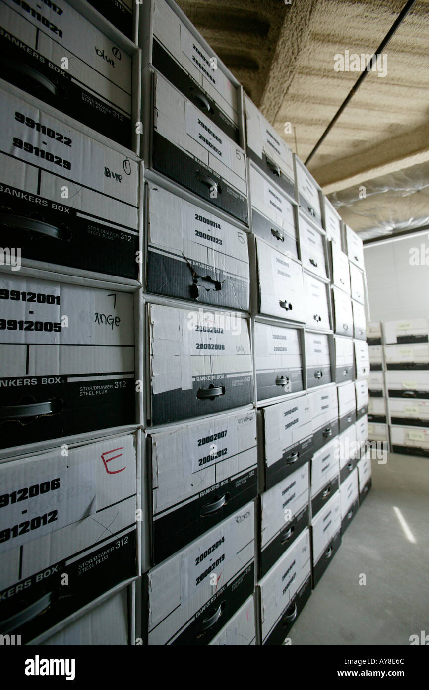 Files Of Paperwork Stored In Boxes In Office Building Storage Facility