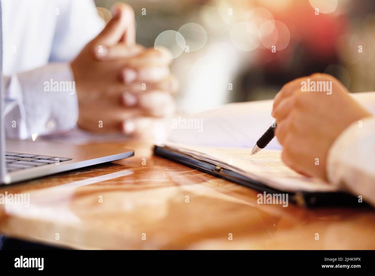 Filling Out The Paperwork An Unrecognizable Car Salesman Talking To A Customer In His Office At