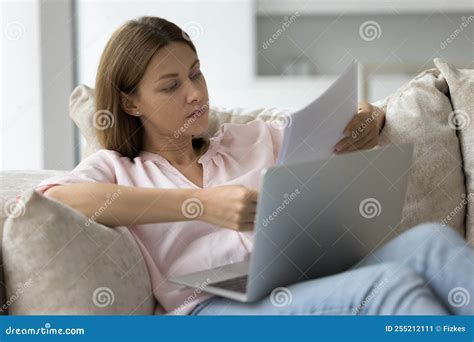 Focused Serious Millennial Freelance Business Woman Doing Paperwork