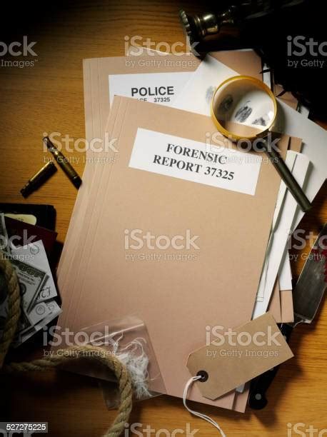 Forensic And Police Paperwork With Evidence From A Crime Stock Photo Download Image Now Istock