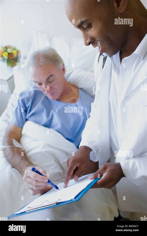 Free Photo Doctor Helping Patient Signing Paperwork Of Medical