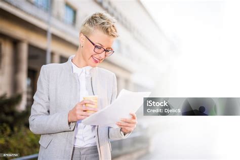 Happy Businesswoman Checking Her Paperwork Stock Photo Download Image Now 20 29 Years 2017