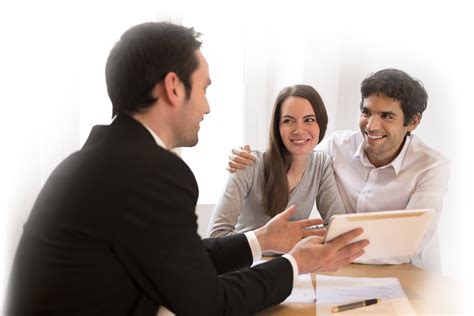 Happy Couple Signing Loan Papers Mgpublications Com