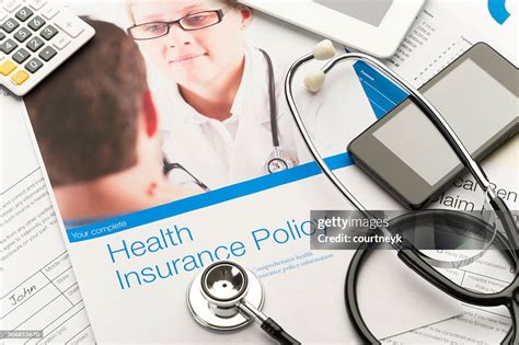 Health Insurance Policy Brochure With Paperwork High Res Stock Photo