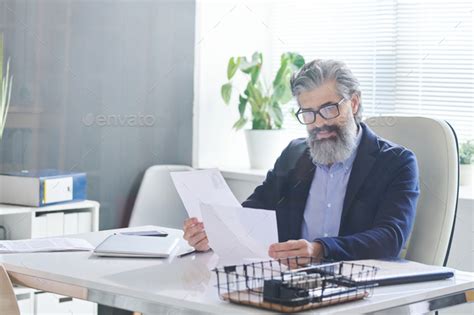 Hr Manager Reading Cv Papers Stock Photo By Pressmaster Photodune