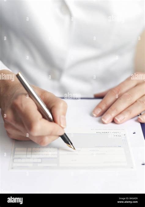 Human Hands Filling Out Medical Paperwork Stock Photo Alamy