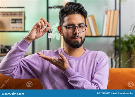 Indian Man Real Estate Agent Showing The Keys Of New Home House Apartment Buying Or Renting