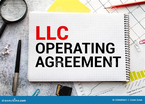 Llc Operating Agreement Write On A Paperwork Isolated On Wooden