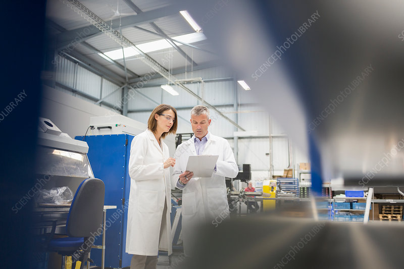 Male Engineers Discussing Paperwork Stock Image F018 7009 Science