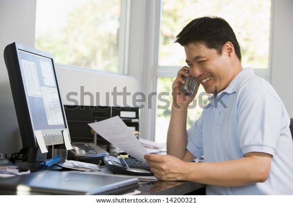 Man In Home Office With Computer And Paperwork Stock Photo Image Of