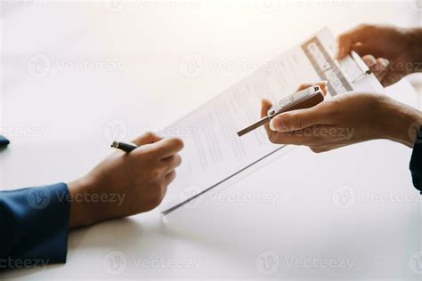 Man Signing Car Insurance Document Or Lease Paper Writing Signature On