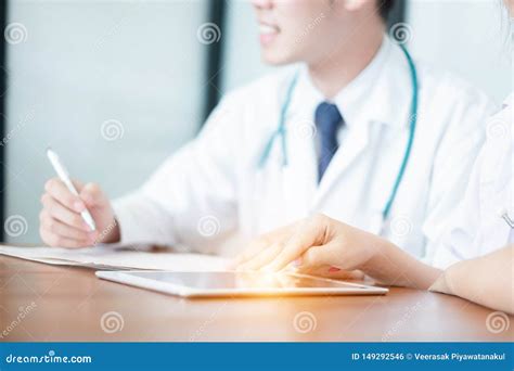 Medical Doctor In White Uniform Writing Result And Prescription On Paperwork Medical Concept