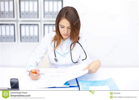 Medical Store Employee Doing Some Paperwork Stock Photo Download