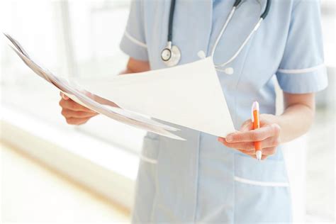 Nurse With Paperwork Photograph By Ian Hooton Science Photo Library