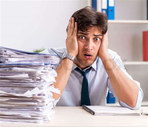 Overloaded Busy Employee With Too Much Work And Paperwork Stock Image Colourbox