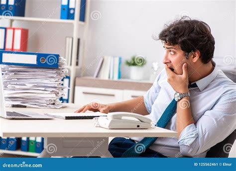 Overloaded Busy Employee With Too Much Work And Paperwork Stock Image