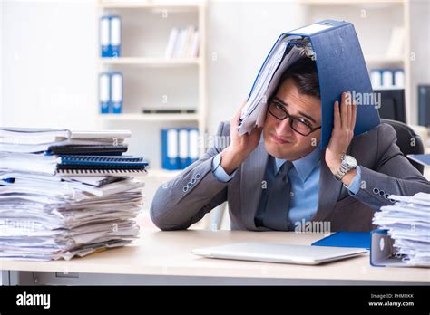 Overloaded With Work Employee Under Paperwork Burden Stock Photo Alamy